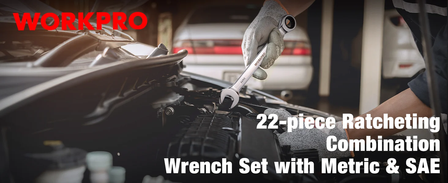 Mechanic holds a ratcheting wrench over a car engine bay, with gloves and tools in a garage workshop