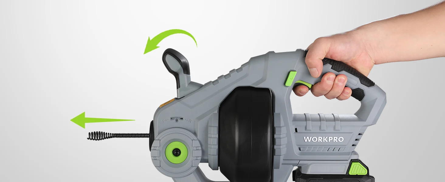 Hand operating a gray and green power tool with innovation and quality features shown on the housing