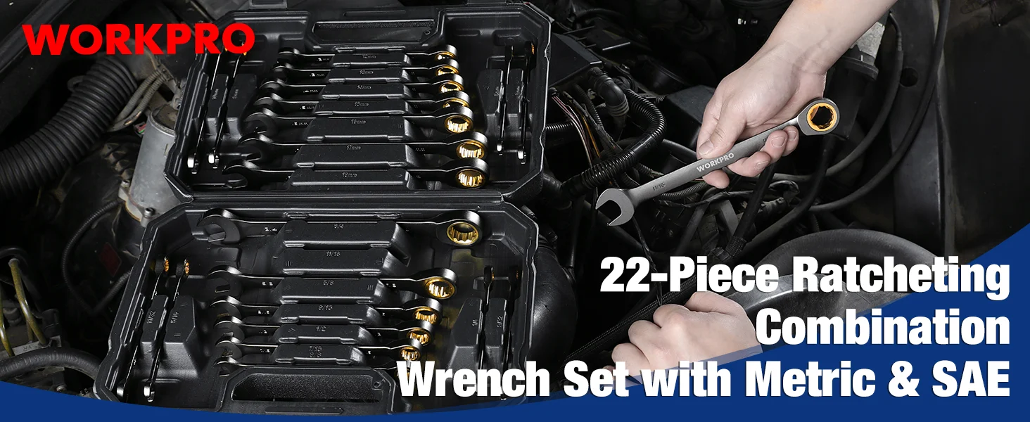 Ratchet wrench set in a black tool case with gold accents, held in a hand over a car engine bay
