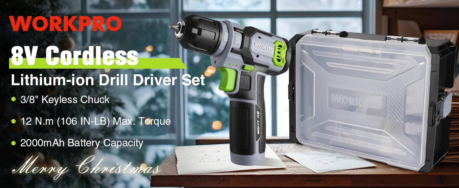 Cordless drill driver set with green and gray body, battery label, and clear case on a workbench