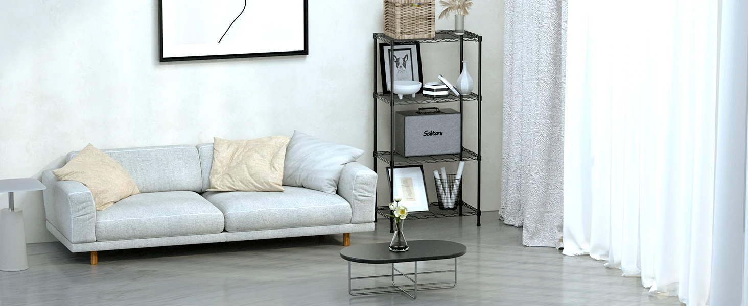 Living room with a light gray sofa, white curtains, and a black metal shelving unit with decor and framed art