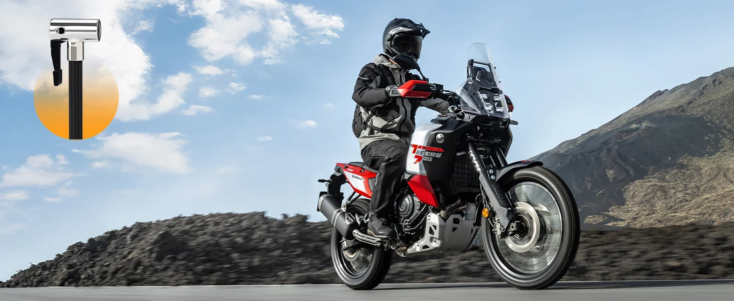Motorcycle rider on a road with mountains in the background, innovation and quality shown in the design