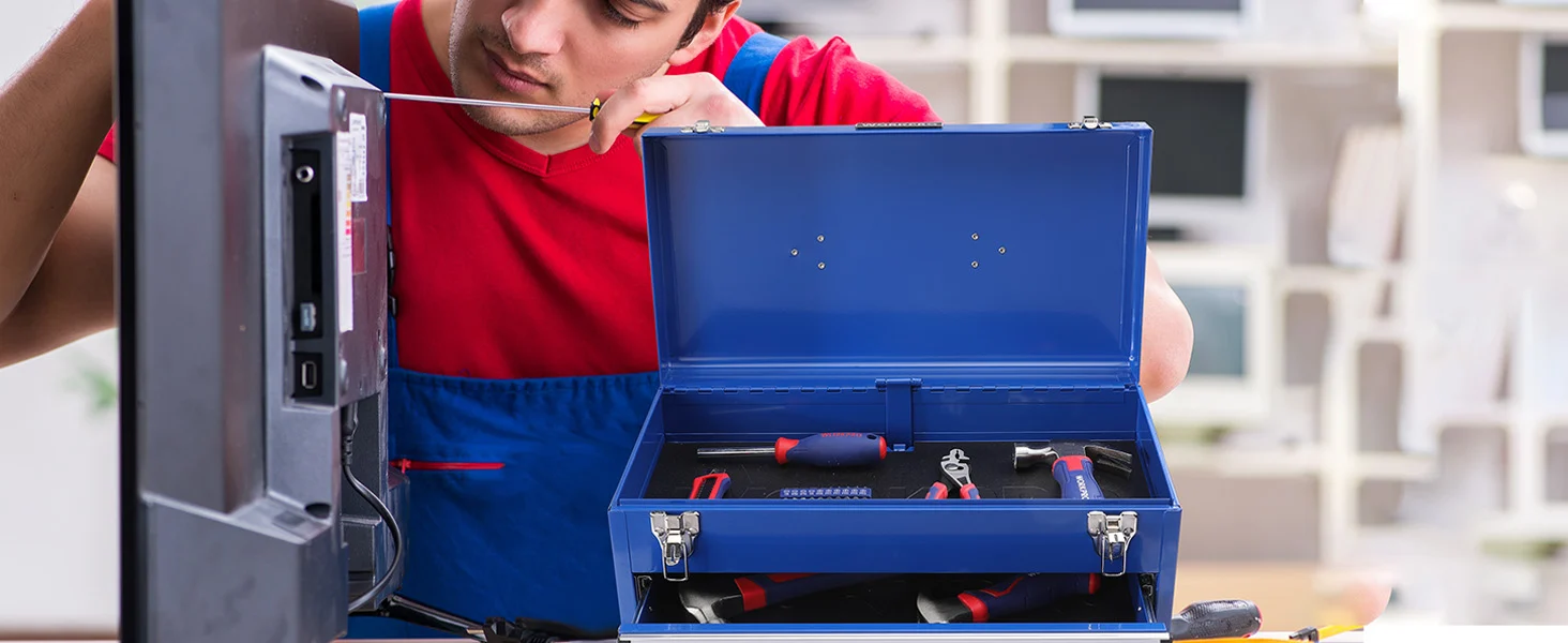 Technician in red shirt and blue overalls with a blue tool case open, showing innovation and quality tools