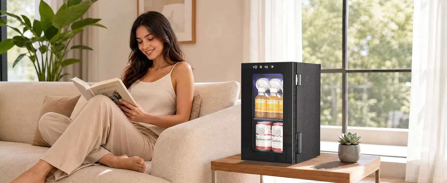 Kismile WC5810 mini beverage refrigerator on a side table beside a woman reading