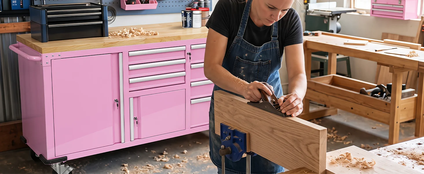 Woodworker using a hand tool near a pink tool cabinet, innovation and quality in a workshop setting