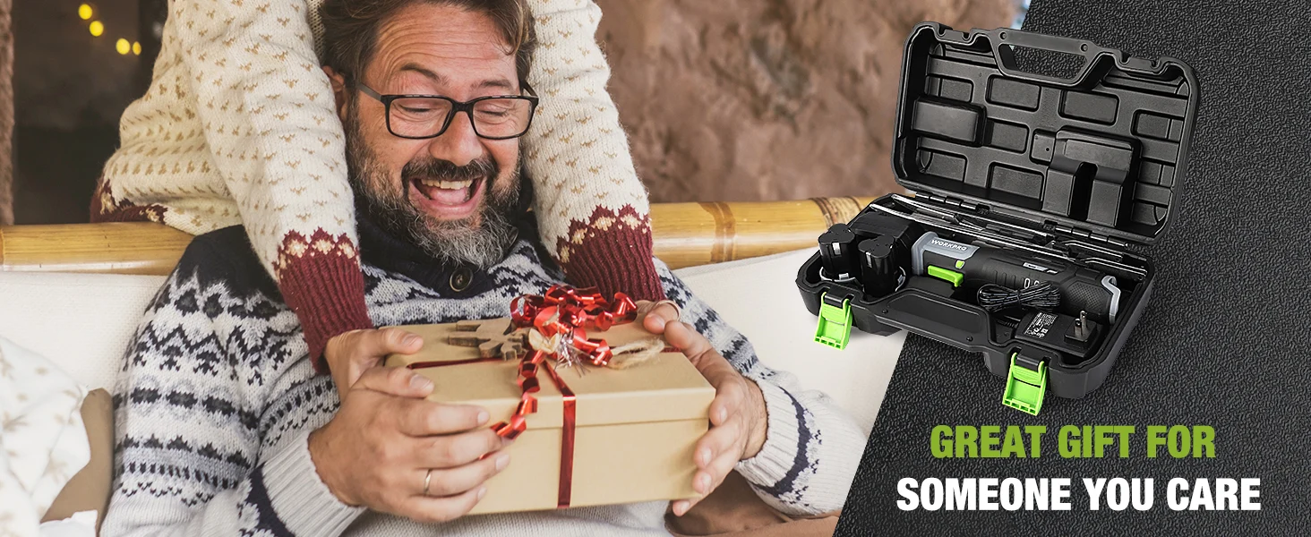 Man in a winter sweater opening a wrapped gift on a couch, with a tool case beside him