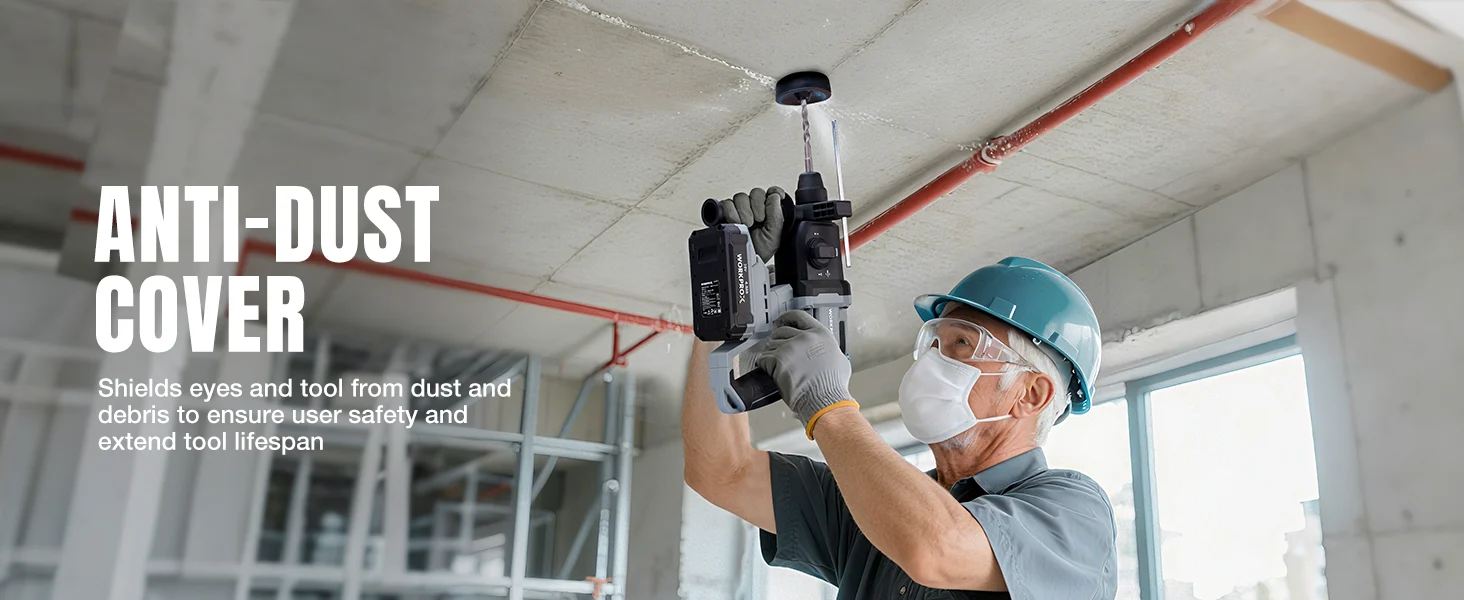 Construction worker in a workshop wearing a hard hat and dust mask while installing an anti dust cover