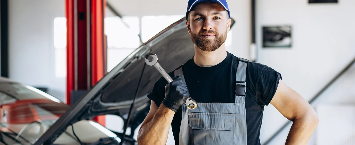 Mechanic in a workshop holding a wrench, with innovation and quality focused on durable, secure repairs
