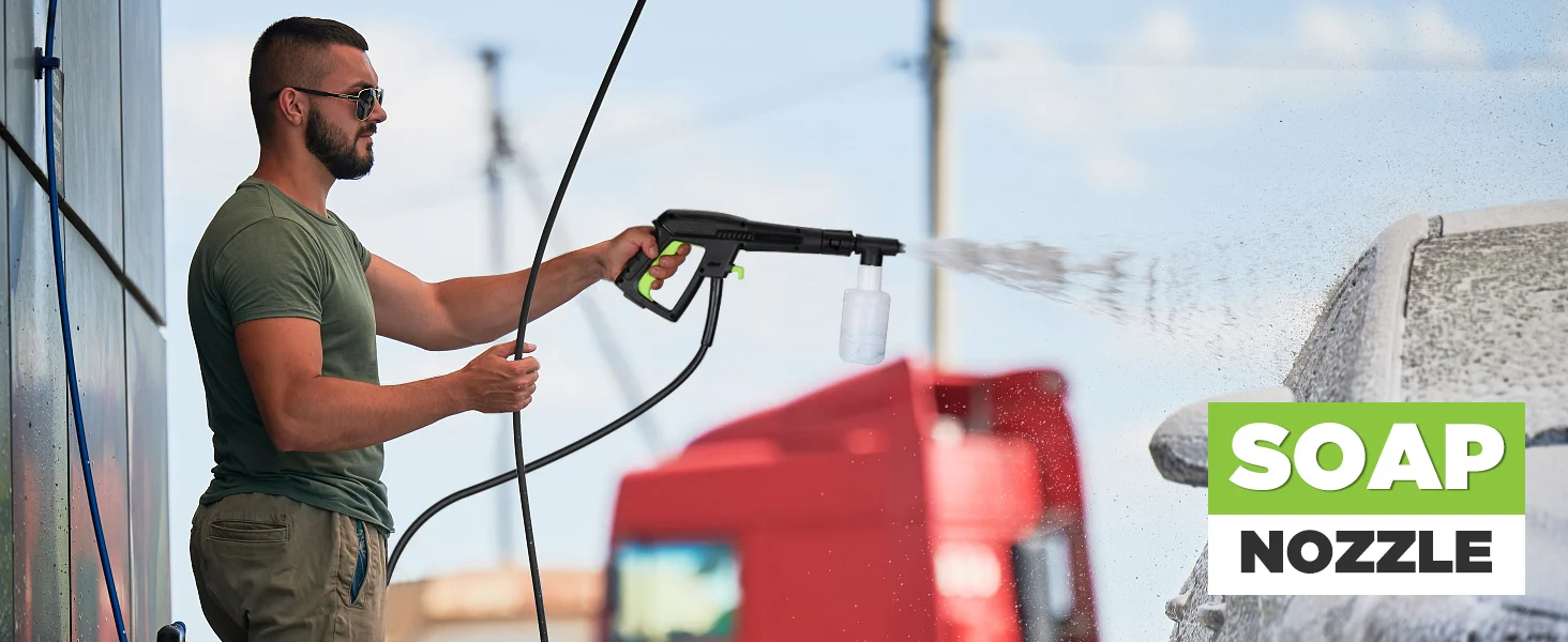 Man pressure washing a white wall with a nozzle sprayer, soap nozzle visible, with water spray and foam