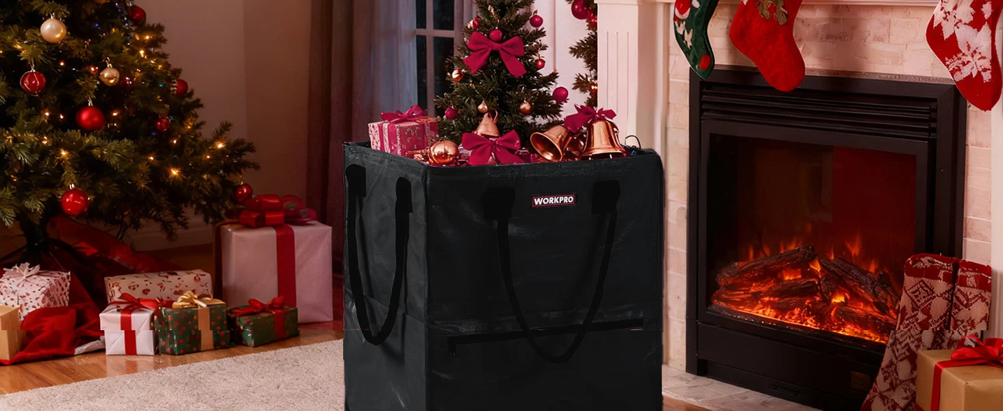 Black shopping bag with handles beside a Christmas tree and wrapped gifts near a lit fireplace