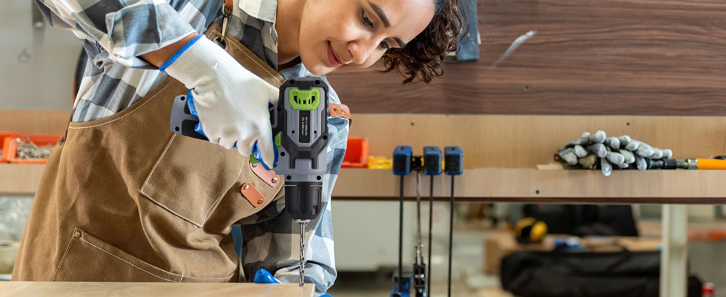 Worker drilling wood in a workshop with a power tool, showing innovation and quality in a secure, durable job