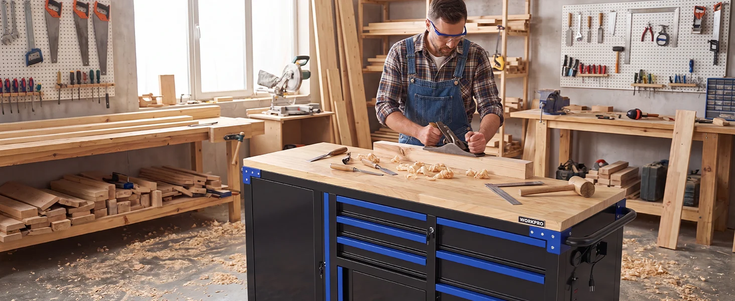 Woodworking workshop with a man planing a board at a blue tool cart, innovation and quality in use