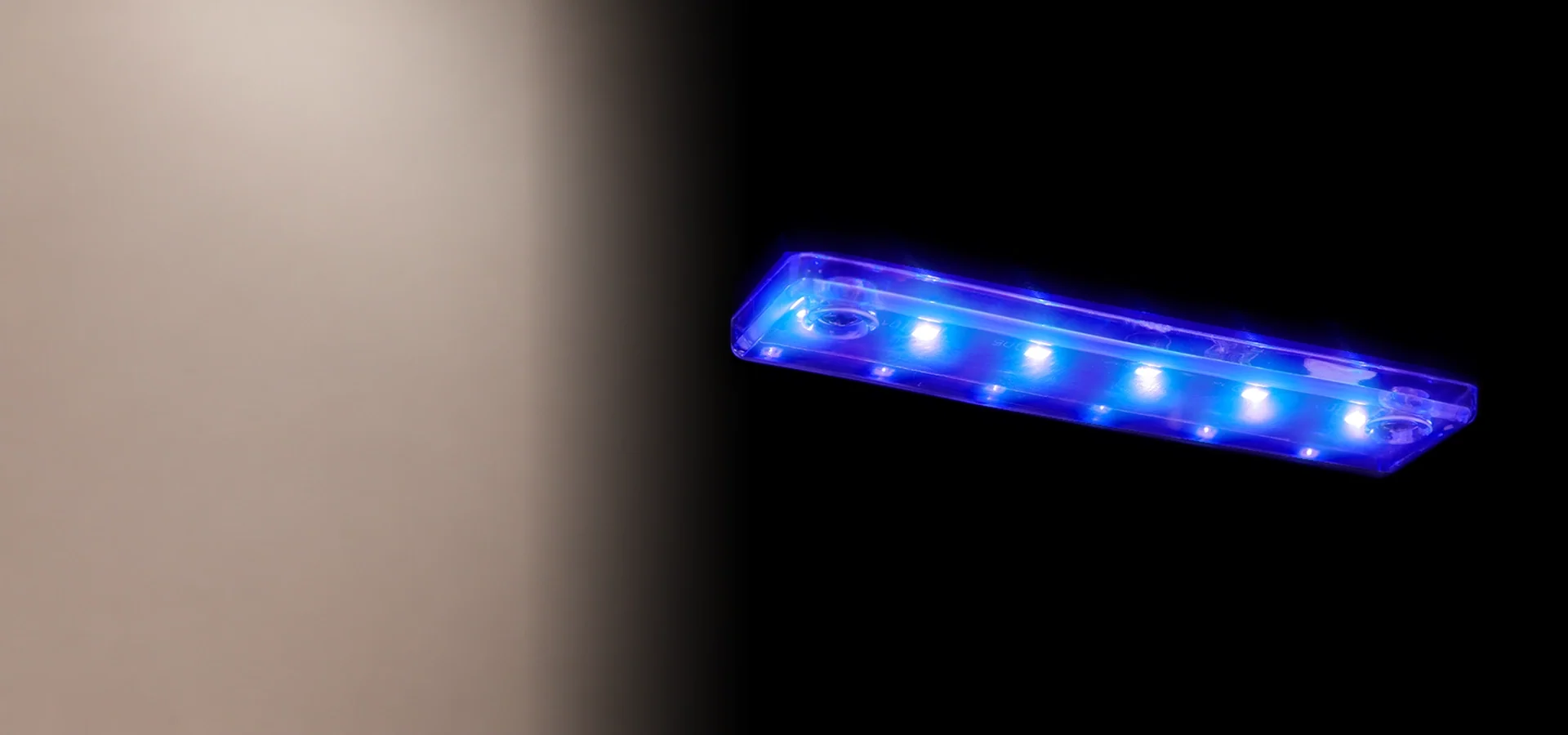 Blue LED interior lighting in the Kismile WC5810 mini beverage refrigerator
