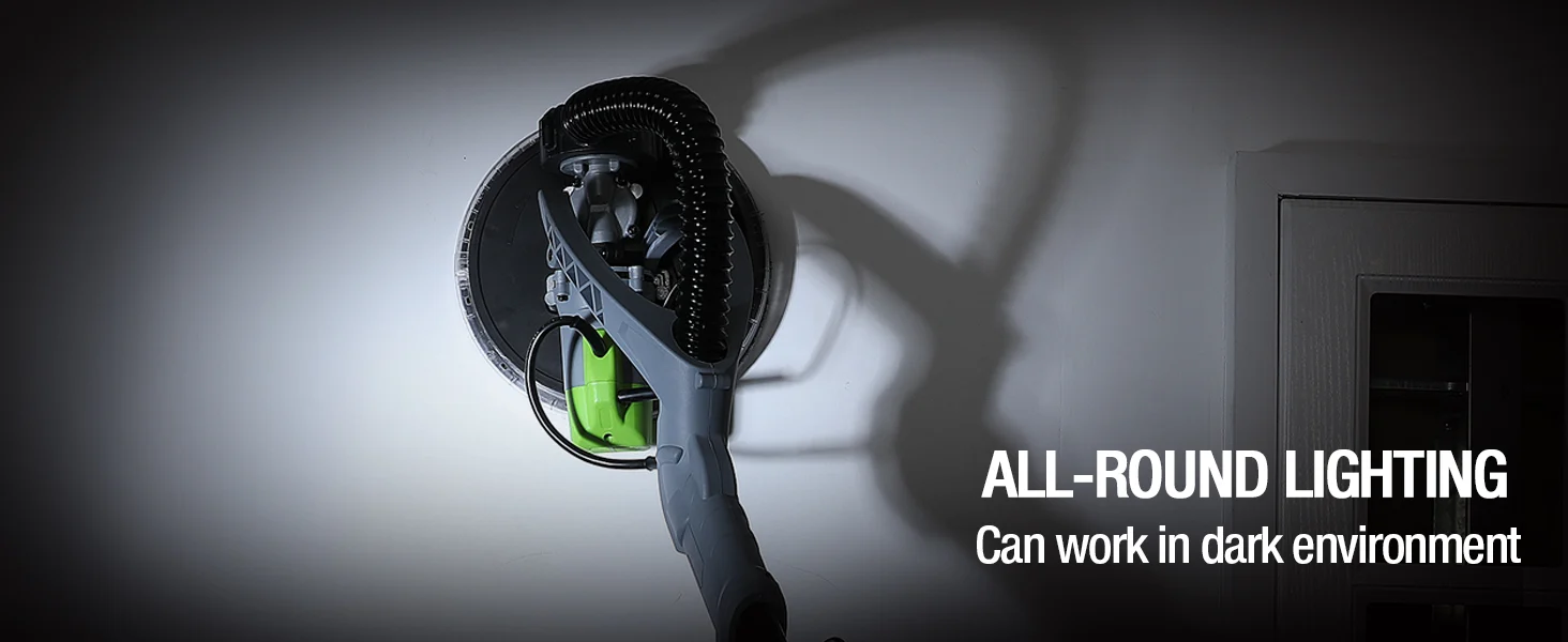 Handheld vacuum head with green and black parts, shown against a wall light, with innovation and quality