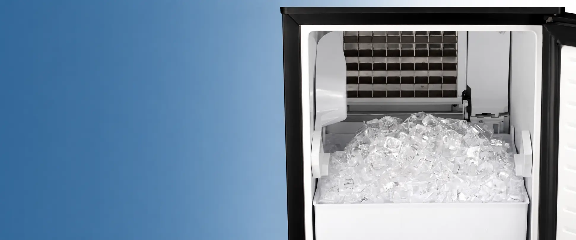 Built-in ice maker interior with a full storage bin of clear ice cubes
