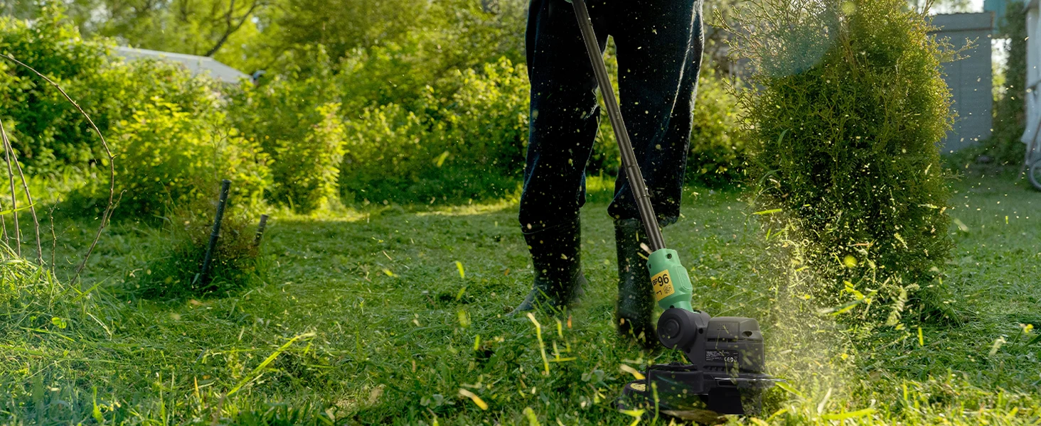 Lawn mower cutting green grass with flying clippings, showing innovation and quality in outdoor yard work