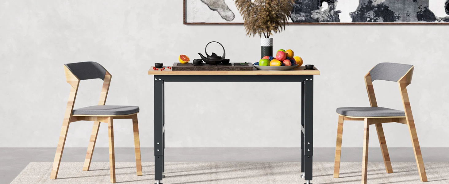Kitchen table with black metal legs and wooden top, set with cookware and fruit, innovation and quality shown