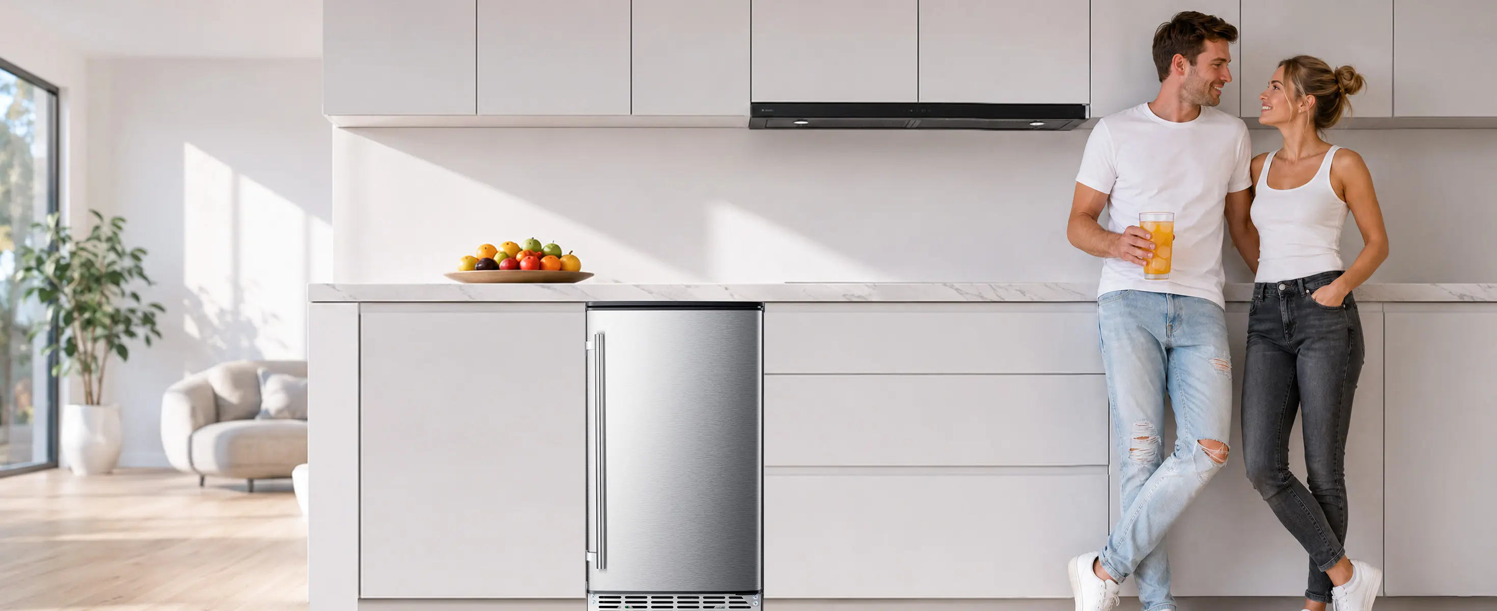 Built-in ice maker installed in a bright modern home kitchen with stainless steel finish