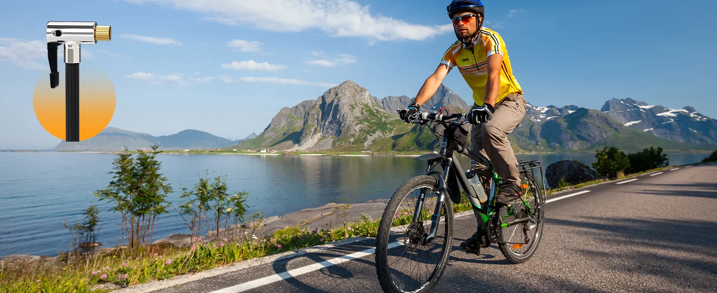 Bicycle rider with a mountain backdrop on a lakeside road, innovation and quality shown in the scene