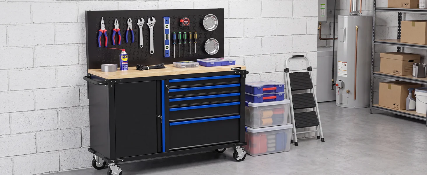 Tool cabinet in a garage workshop with wrenches, drawers, plastic bins, and a step ladder against white brick