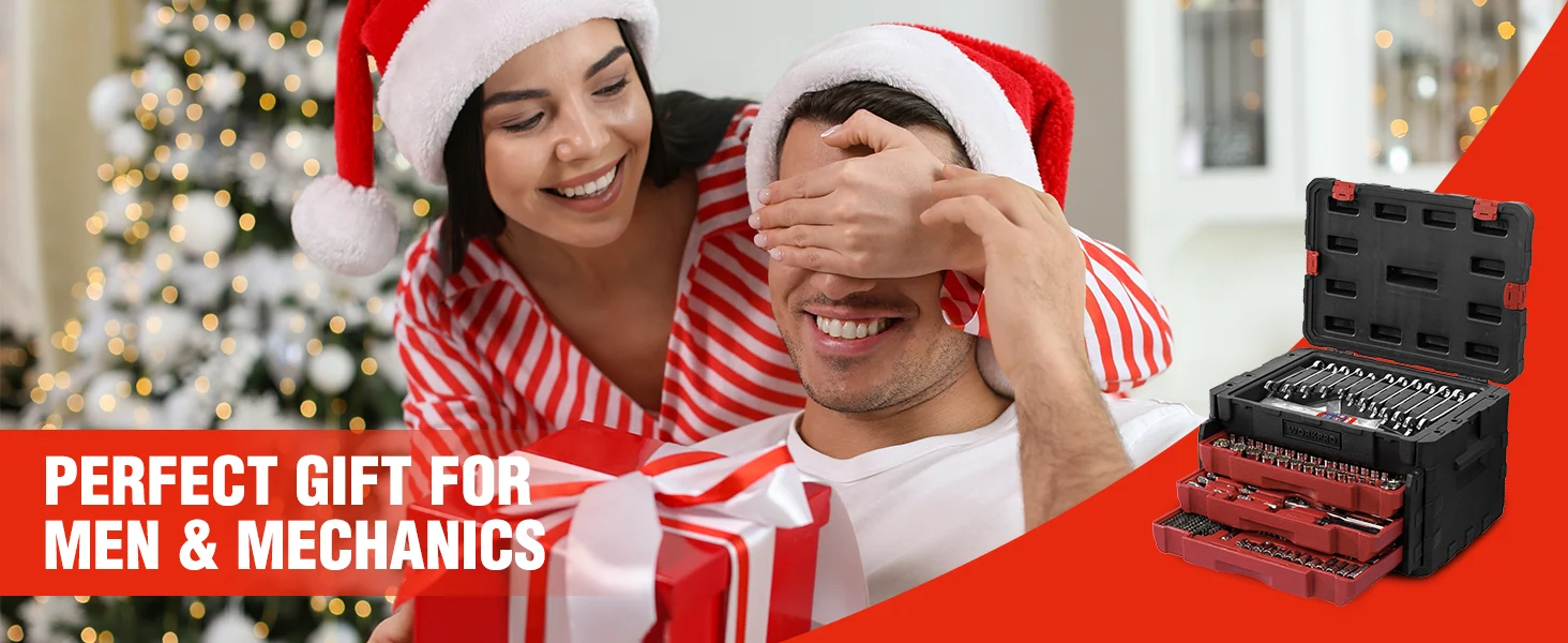 Santa hat couple smiling indoors, with a tool kit case and bits in a red and black case