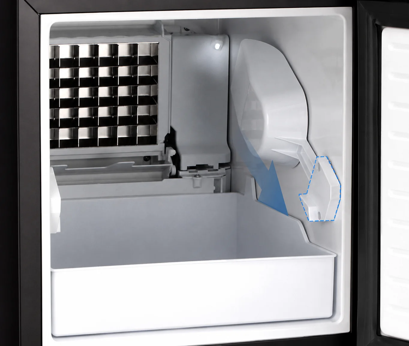 Built-in ice maker interior with integrated ice scoop for easy ice access
