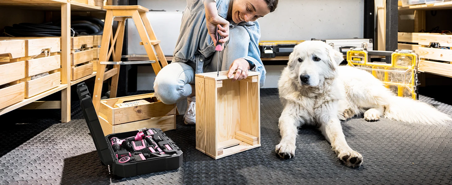 Worker assembling a wooden crate with a dog nearby, innovation and quality shown in the workshop setting