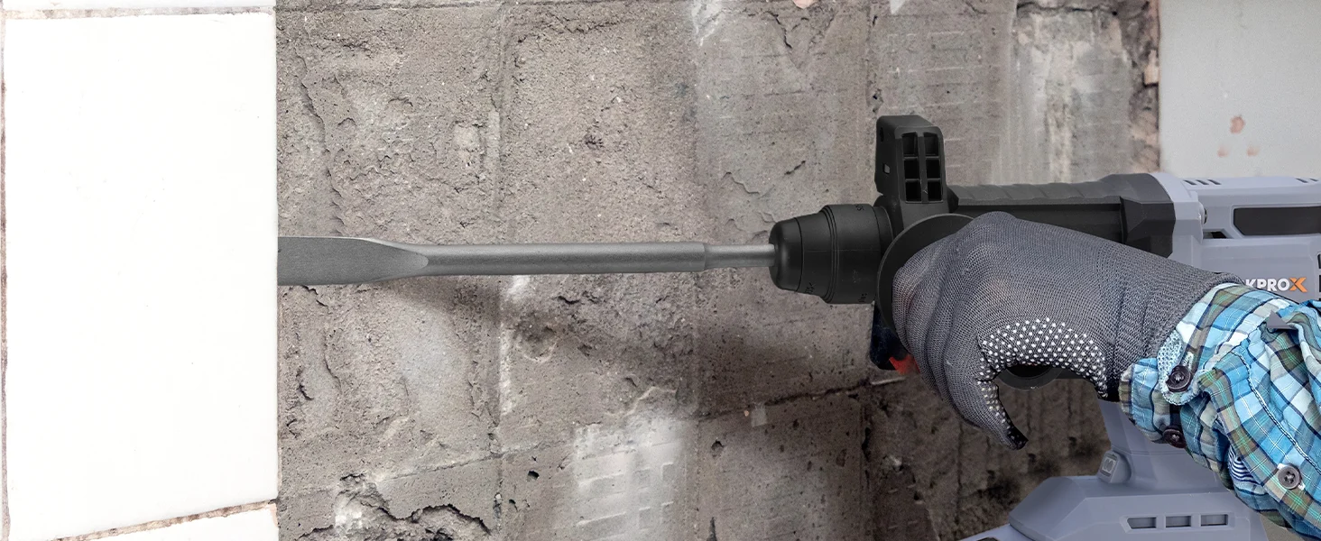 Hand in gray glove using a power drill on a concrete wall, showing innovation and quality in construction