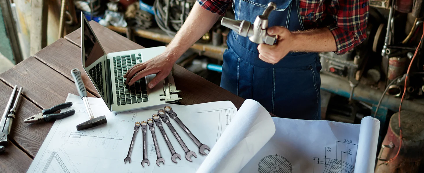 Technician in a workshop uses a laptop and tools on blueprints, showing innovation and quality in repair work